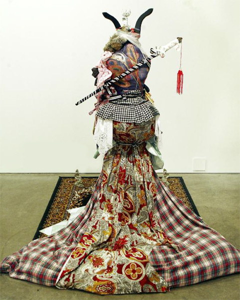 Shinique Smith "Crone Huntress" Clothing, fabric, and found objects, 172" x 36" x 36", 2007. Rubell Family Collection.