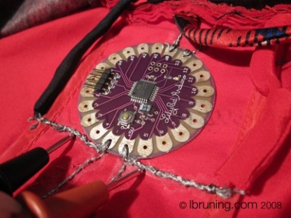 Bruning Detail of Lilypad Arduino and conductive thread used in Haptic Coat for the Blind by Lynne Bruning 2008