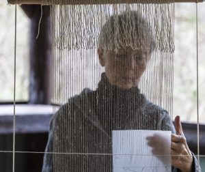 Tommye McClure in process weaving