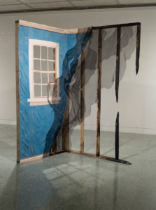 Surface Design Association Outstanding Students 2023 - Emily Chase (she/her), What Remains, 2023. Hand dyed, discharged, printed and quilted cotton sateen, silk organza, carved on scorched pine lumber, 98 x 49 x 67 inches. Photo by the artist. Graduate, Indiana University Bloomington. @inkstandstudio