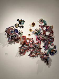 Surface Design Association Outstanding Students 2023 - Nicole Prancik (she/her), Microcosmic Beings, 2023. Crocheted yarn with welded frame, 72 x 48 inches. Photo by the artist. Undergraduate, Drake University. @nicolivia_art