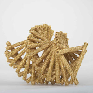 Fans of golden coils are spun around a center.